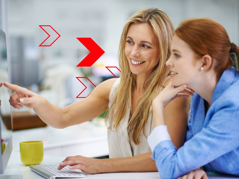Profissionais analisam informações em sistema de gestão, representando o uso da inteligência artificial empresarial para interpretar dados, automatizar processos, apoiar a tomada de decisões e aumentar a eficiência operacional da empresa.
